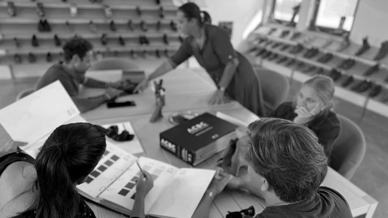 The Giordano Dieci team reviewing samples and colour swatches around a table