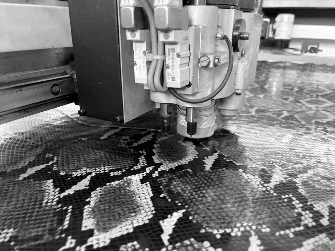 Automated cutting of python-print leather