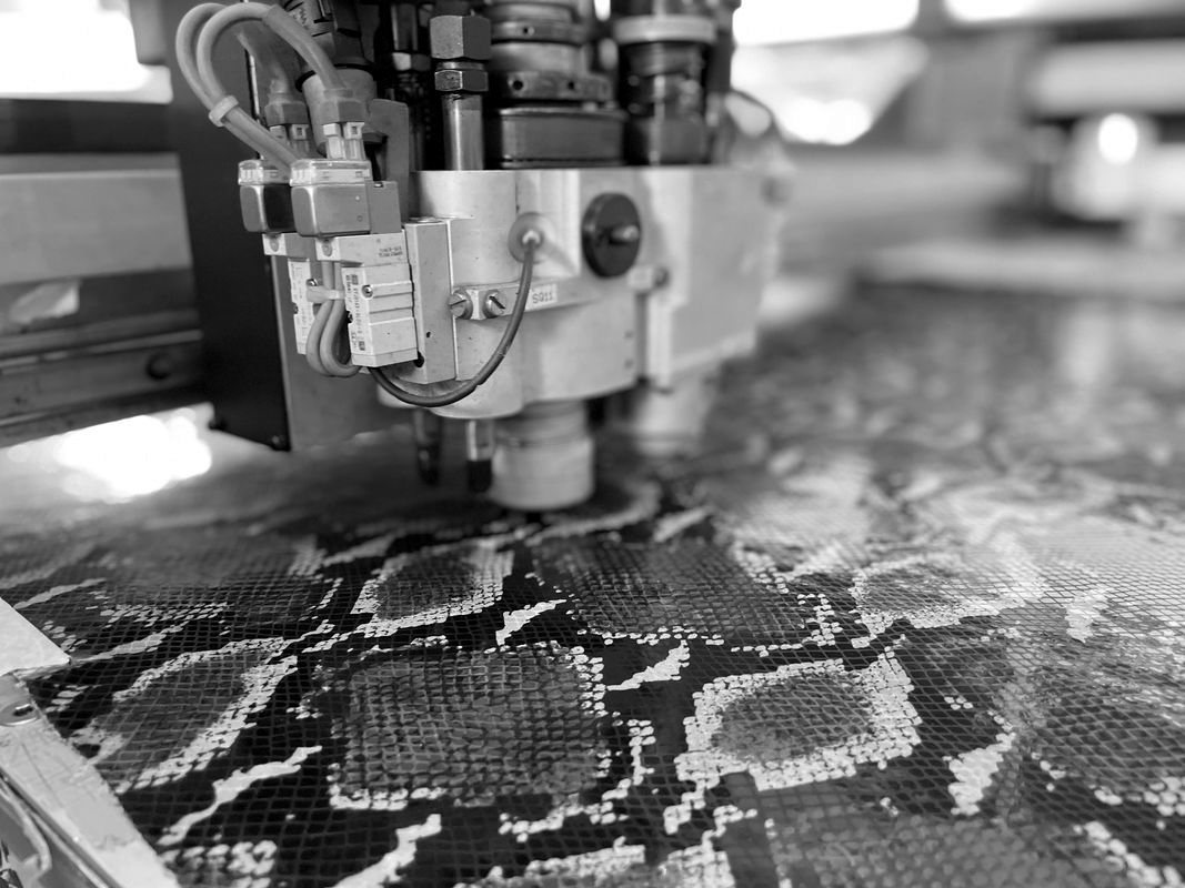 Python-print leather on the cutting table