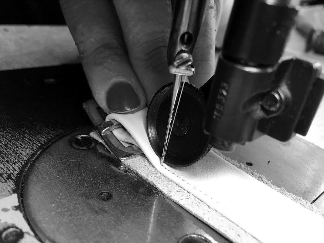 Stitching the edge of a leather upper