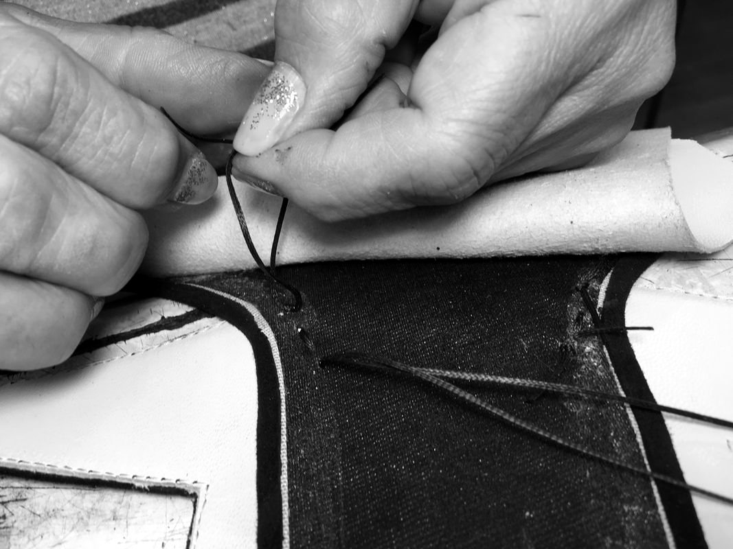 Hand-stitching a leather upper