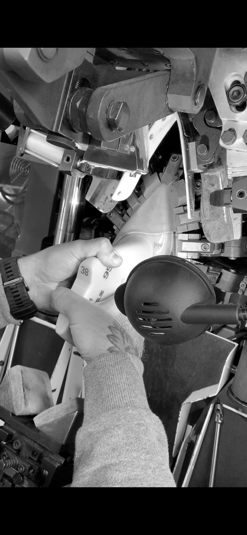 Shoe being shaped on a lasting machine