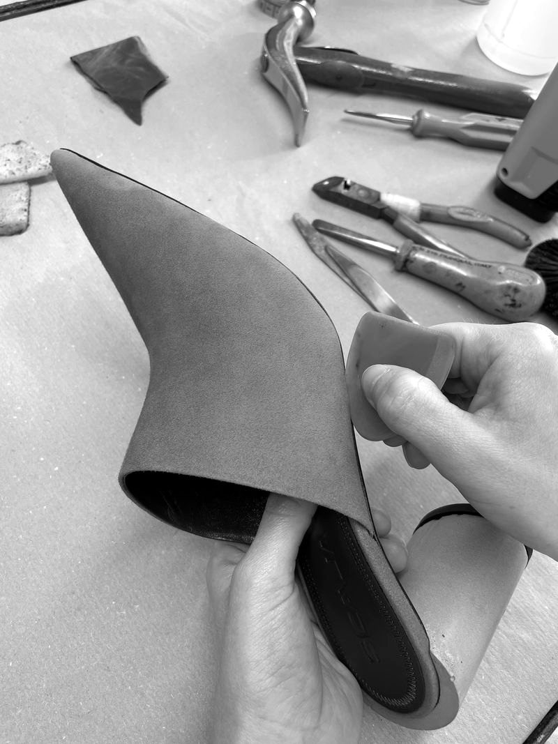 Suede shoe being assembled on the workbench