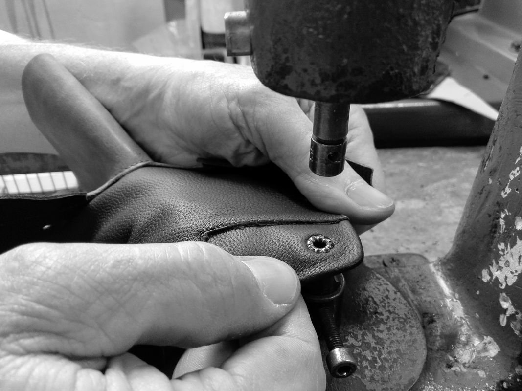 Working a leather upper at the press