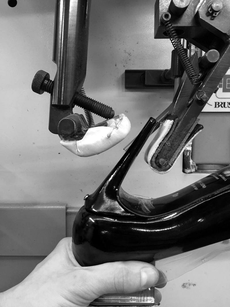 Attaching a heel to a black patent shoe