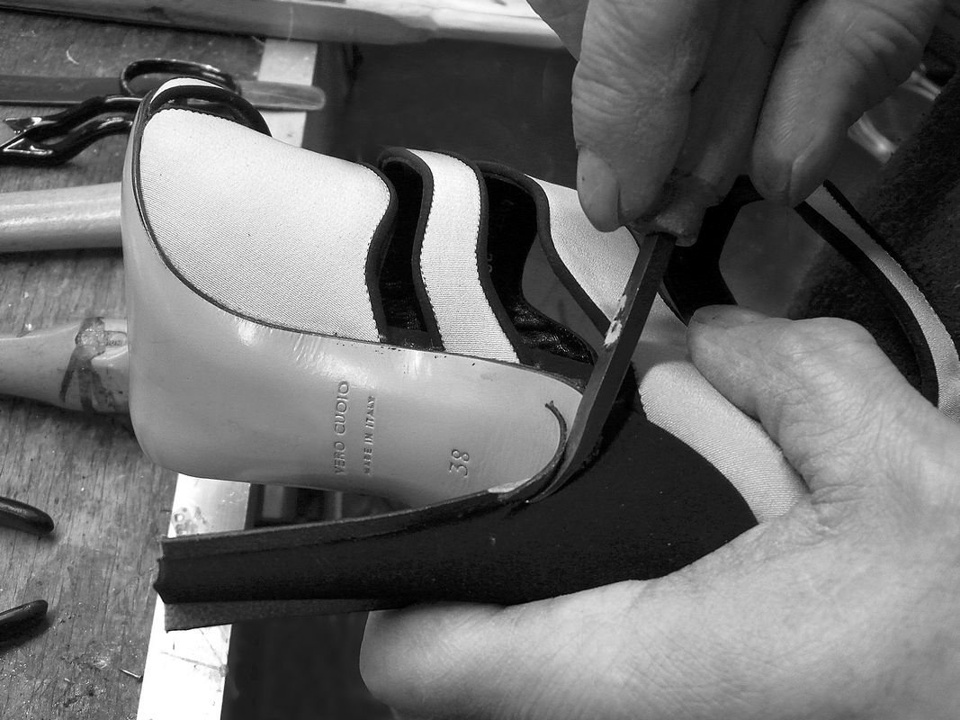 Trimming leather around the heel with a blade